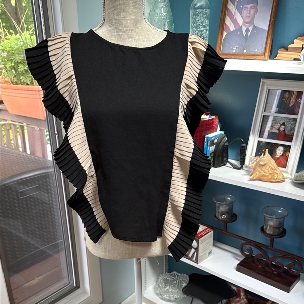 Elegant Black and Cream Ruffle Top